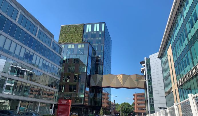 The new bridge over Clarendon Road and the newly-built glass building (back left) of TJXs HQ 